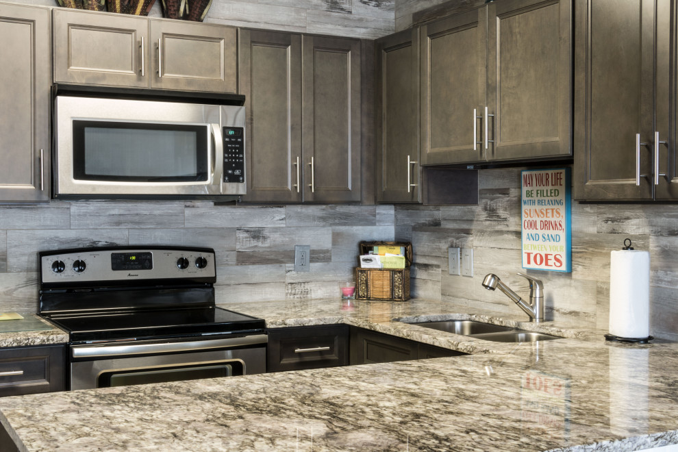 Eat-in kitchen - small rustic u-shaped cement tile floor and beige floor eat-in kitchen idea with an undermount sink, flat-panel cabinets, medium tone wood cabinets, granite countertops, gray backsplash, ceramic backsplash, stainless steel appliances, a peninsula and gray countertops