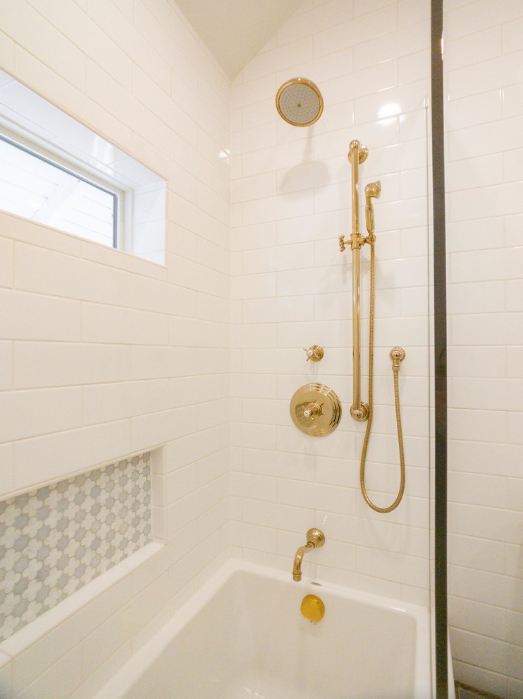 Photo of a mid-sized transitional 3/4 bathroom in Chicago with furniture-like cabinets, medium wood cabinets, an alcove tub, a shower/bathtub combo, a two-piece toilet, white tile, subway tile, white walls, ceramic floors, an undermount sink, marble benchtops, multi-coloured floor, an open shower and multi-coloured benchtops.