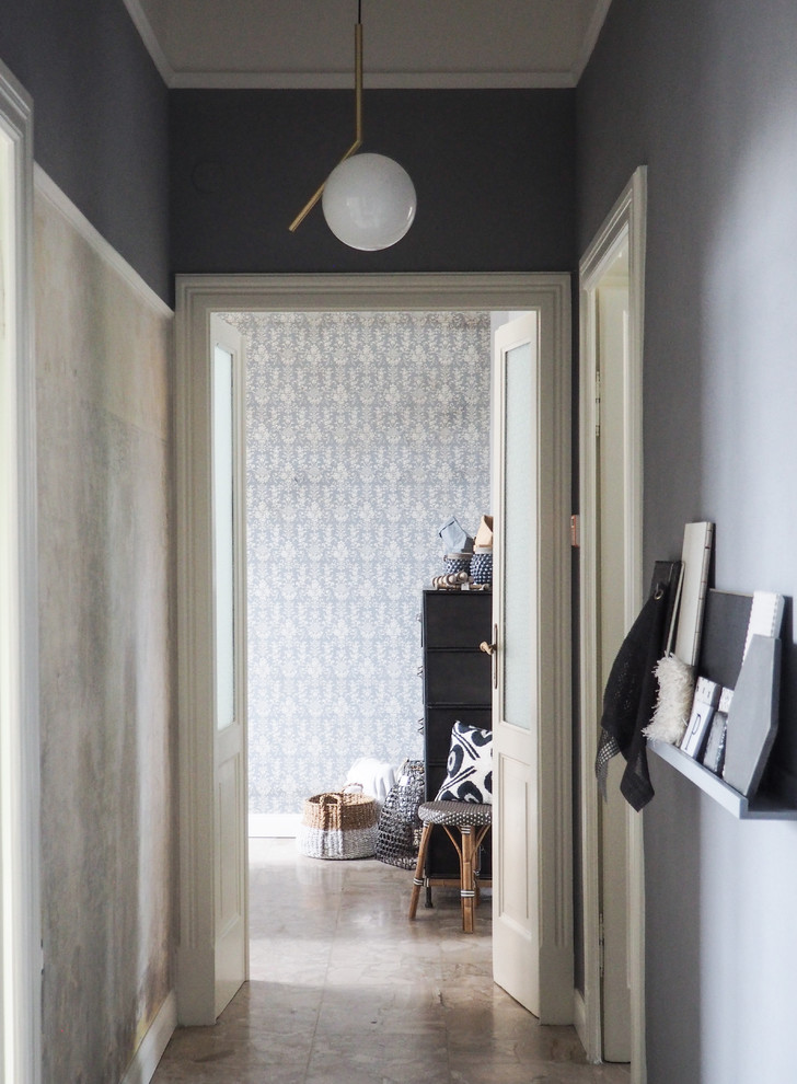 This is an example of a mid-sized scandinavian hallway in Other with grey walls, marble floors and beige floor.