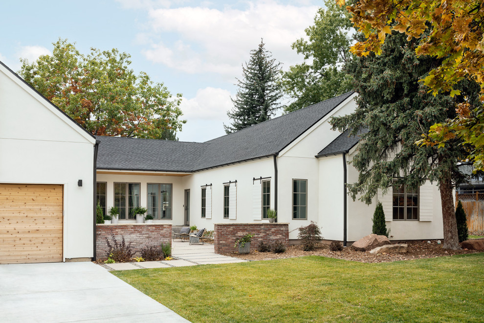 Example of a large farmhouse white one-story house exterior design in Denver with a shingle roof and a gray roof
