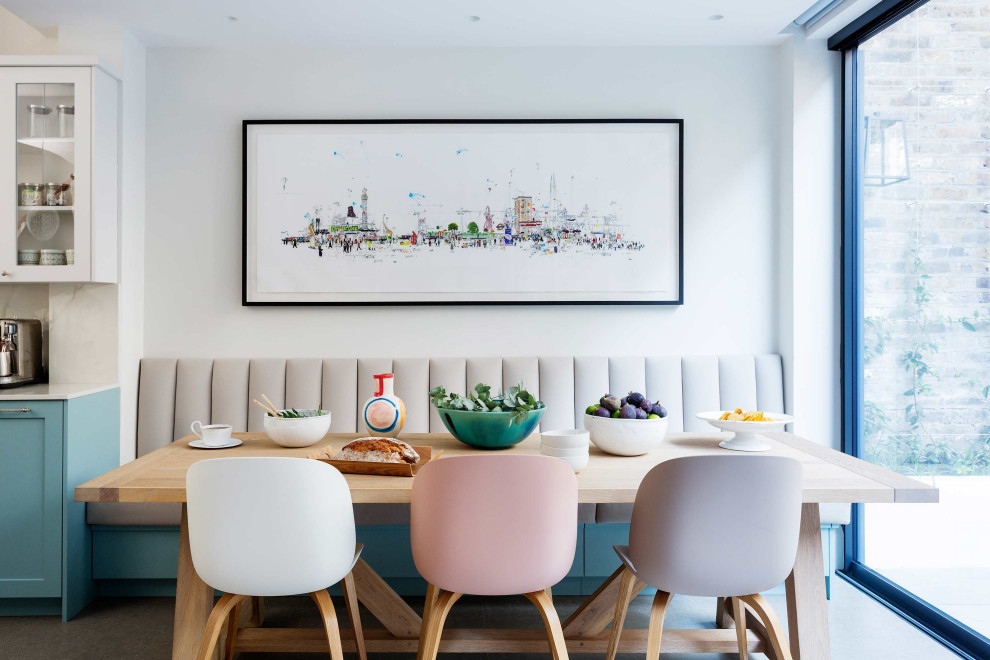 This is an example of a large contemporary kitchen/dining combo in London.