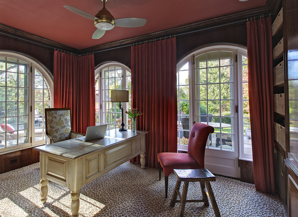 This is an example of an eclectic home office in New York with carpet and a freestanding desk.