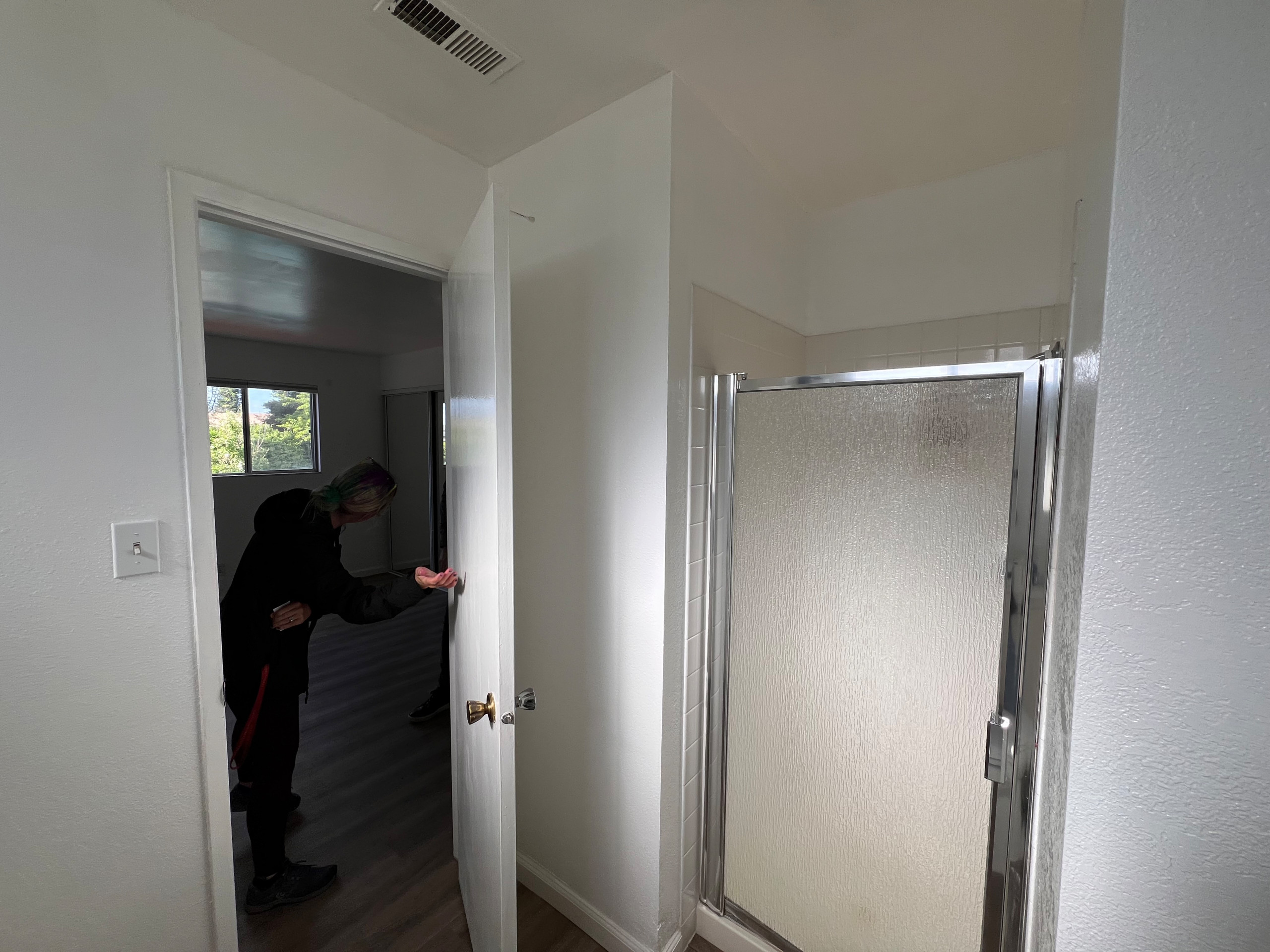 BEFORE! Tiny Shower Enlarged, Hinged Door Changed to a Pocket Door