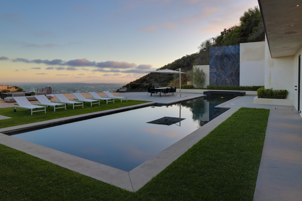 Photo of a large contemporary custom-shaped pool in Los Angeles.