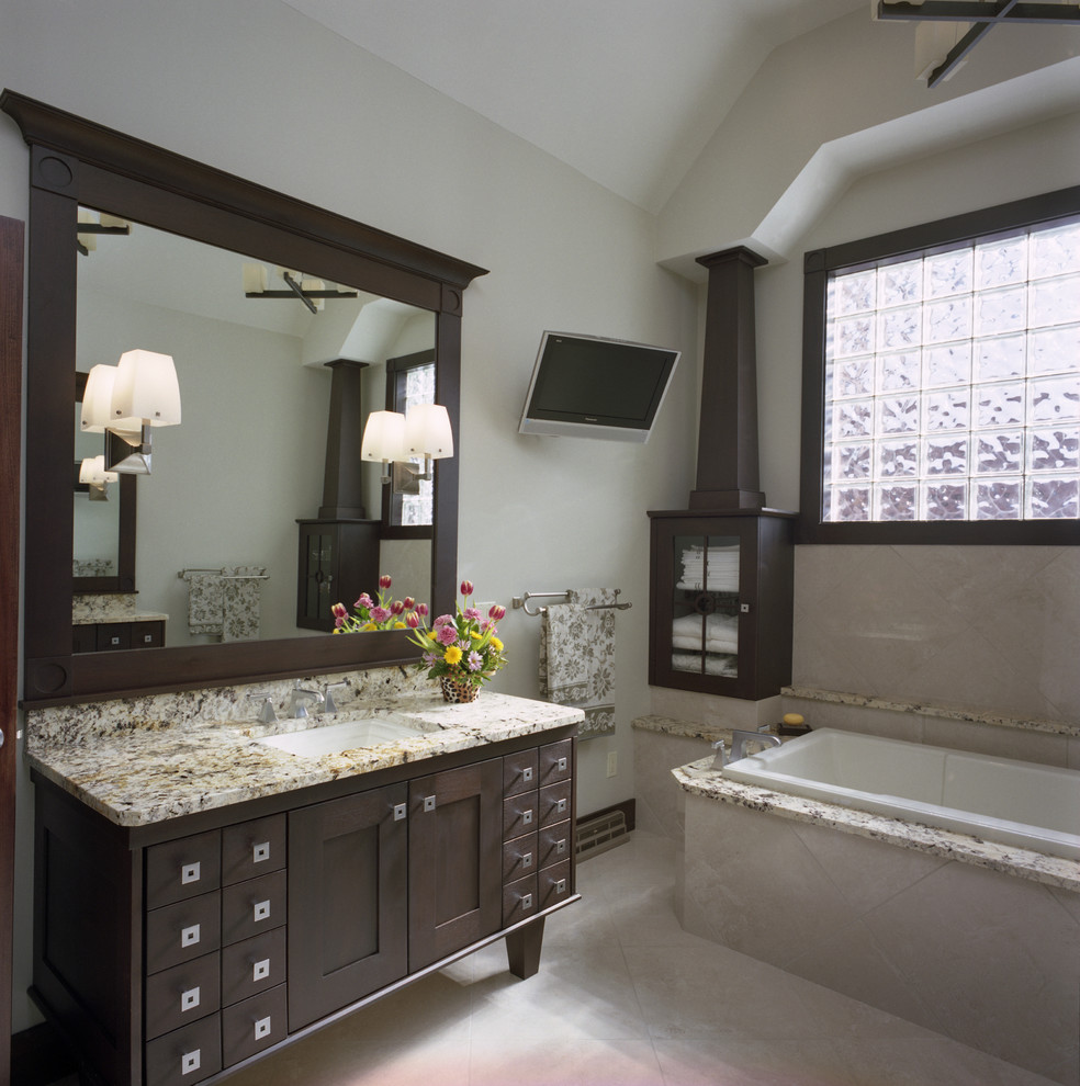 Large contemporary master bathroom in Other with granite benchtops, shaker cabinets, dark wood cabinets, a drop-in tub, beige tile, ceramic tile, beige walls, ceramic floors and an undermount sink.