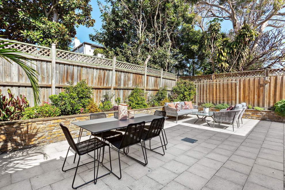 Inspiration for a transitional backyard patio in Sydney.
