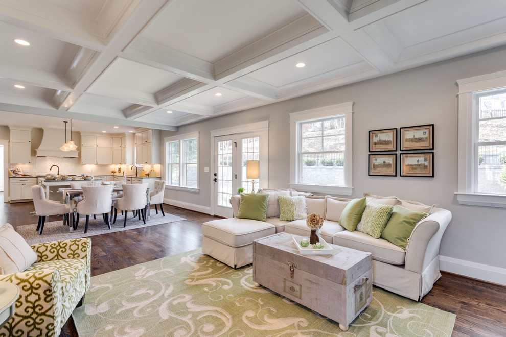 Inspiration for a transitional open concept medium tone wood floor living room remodel in DC Metro with gray walls