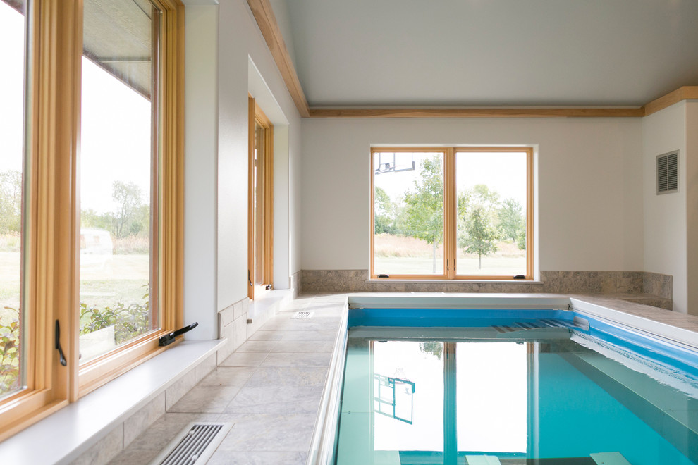 Pool house - mid-sized transitional indoor tile and rectangular lap pool house idea