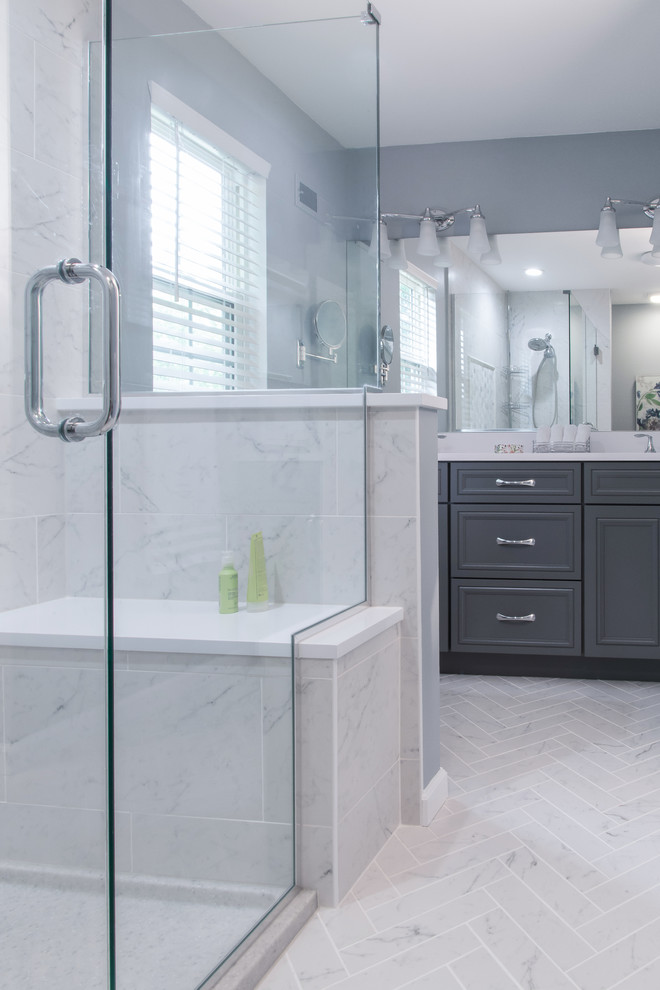 Mid-sized transitional master bathroom in St Louis with recessed-panel cabinets, grey cabinets, an alcove shower, white tile, marble, grey walls, marble floors, an undermount sink, engineered quartz benchtops, grey floor, a hinged shower door and white benchtops.