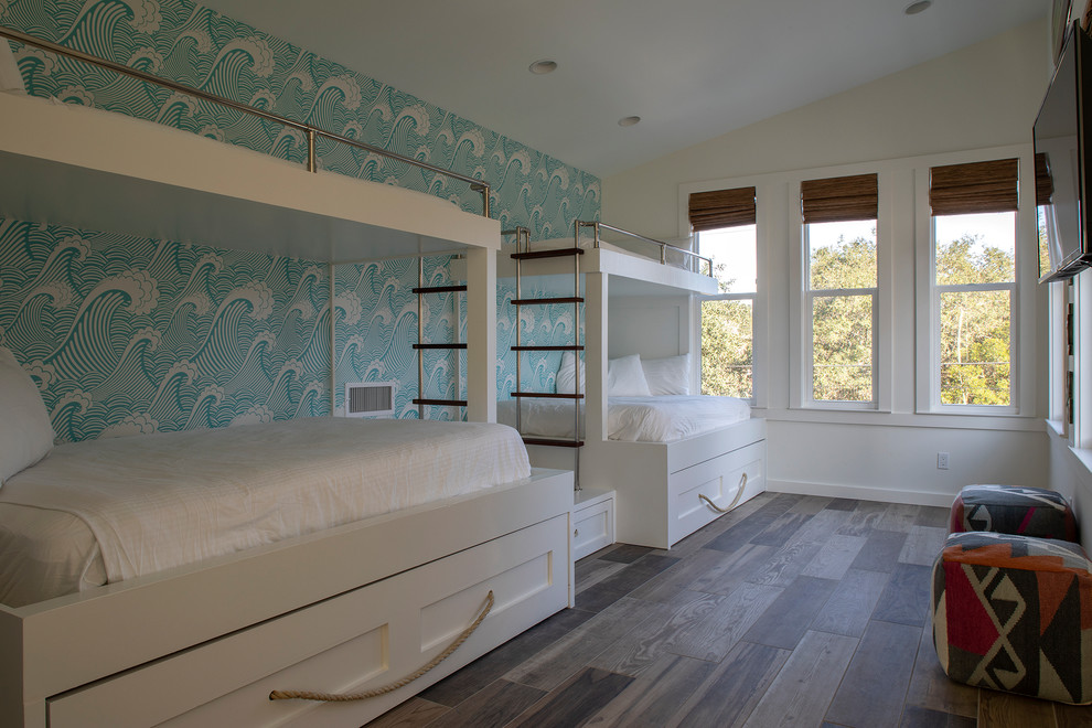 Mid-sized midcentury guest bedroom in Other with multi-coloured walls, ceramic floors and brown floor.