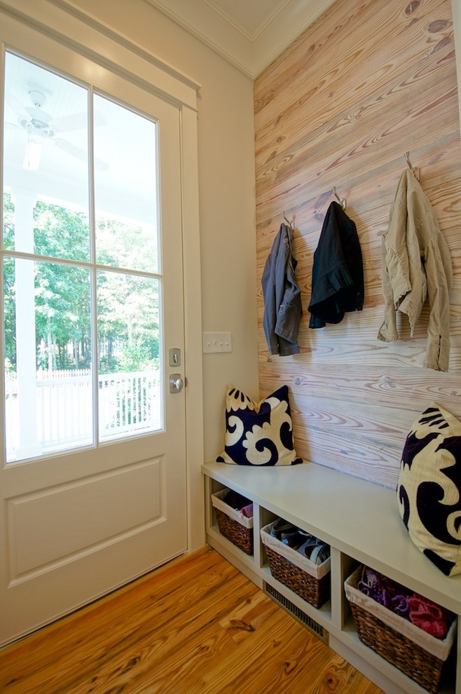 Design ideas for a transitional entryway in Charleston with light hardwood floors.