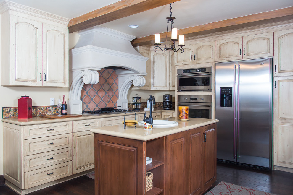 Inspiration for a mid-sized transitional dark wood floor eat-in kitchen remodel with a drop-in sink, light wood cabinets, solid surface countertops, red backsplash, terra-cotta backsplash, stainless steel appliances, an island and recessed-panel cabinets