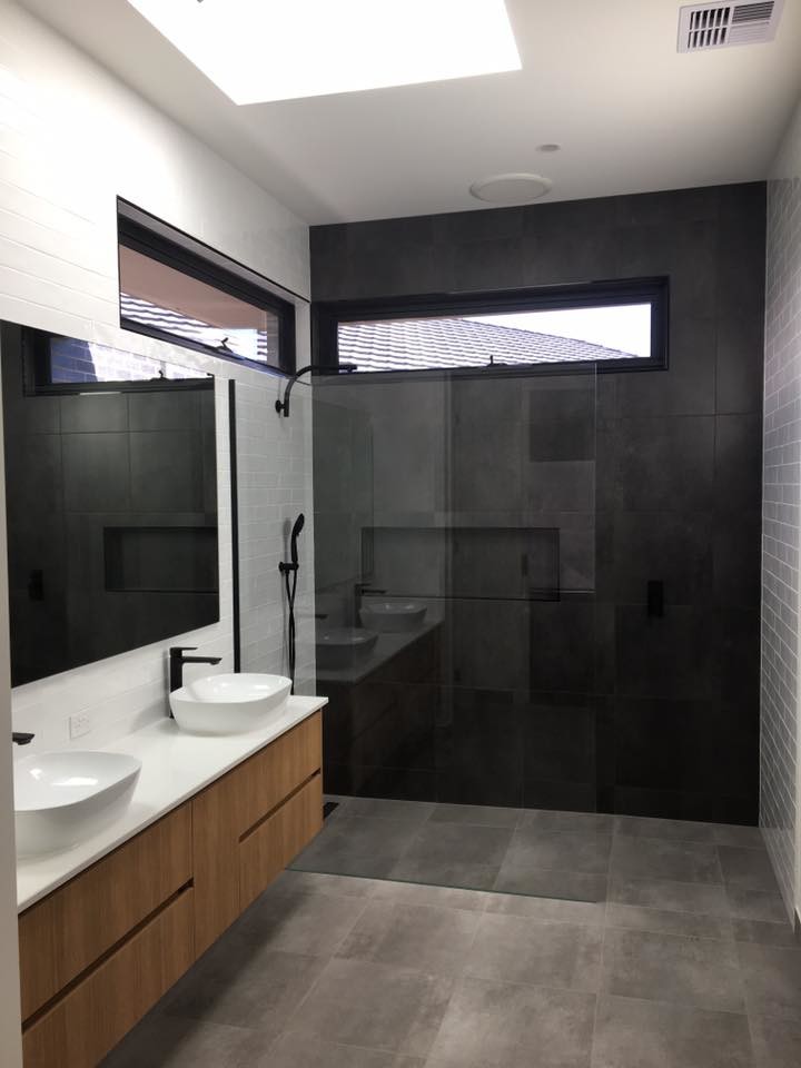 Inspiration for a mid-sized modern master bathroom in Sydney with flat-panel cabinets, light wood cabinets, an open shower, black and white tile, ceramic tile, white walls, ceramic floors, a vessel sink, engineered quartz benchtops, grey floor, an open shower and white benchtops.