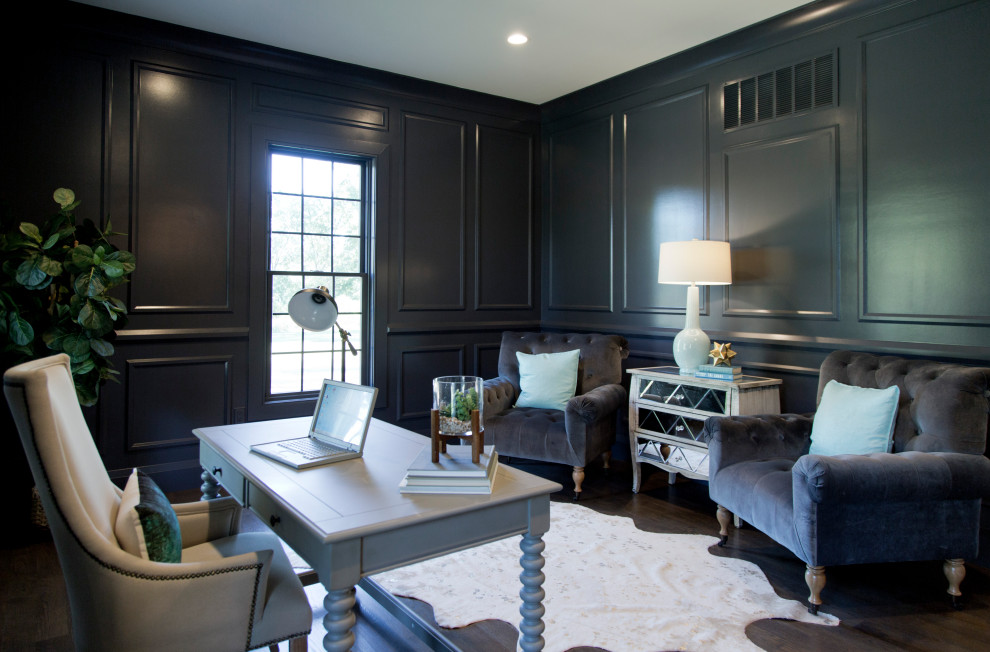Photo of a large transitional home office in St Louis with blue walls, dark hardwood floors, a freestanding desk and brown floor.