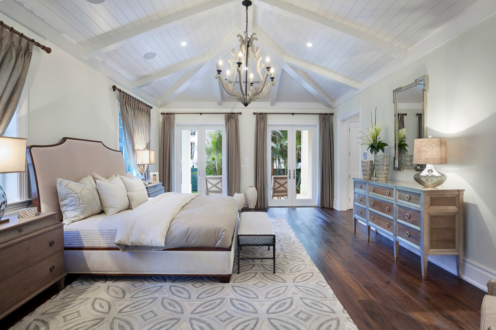 Design ideas for a transitional bedroom in Miami with grey walls and dark hardwood floors.