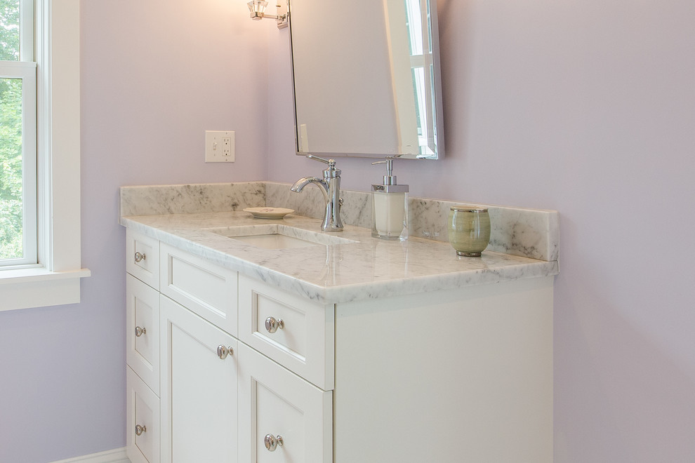 Small traditional kids bathroom in Boston with flat-panel cabinets, white cabinets, an alcove tub, a shower/bathtub combo, white tile, subway tile, purple walls, marble floors, an undermount sink, marble benchtops, white floor and a shower curtain.