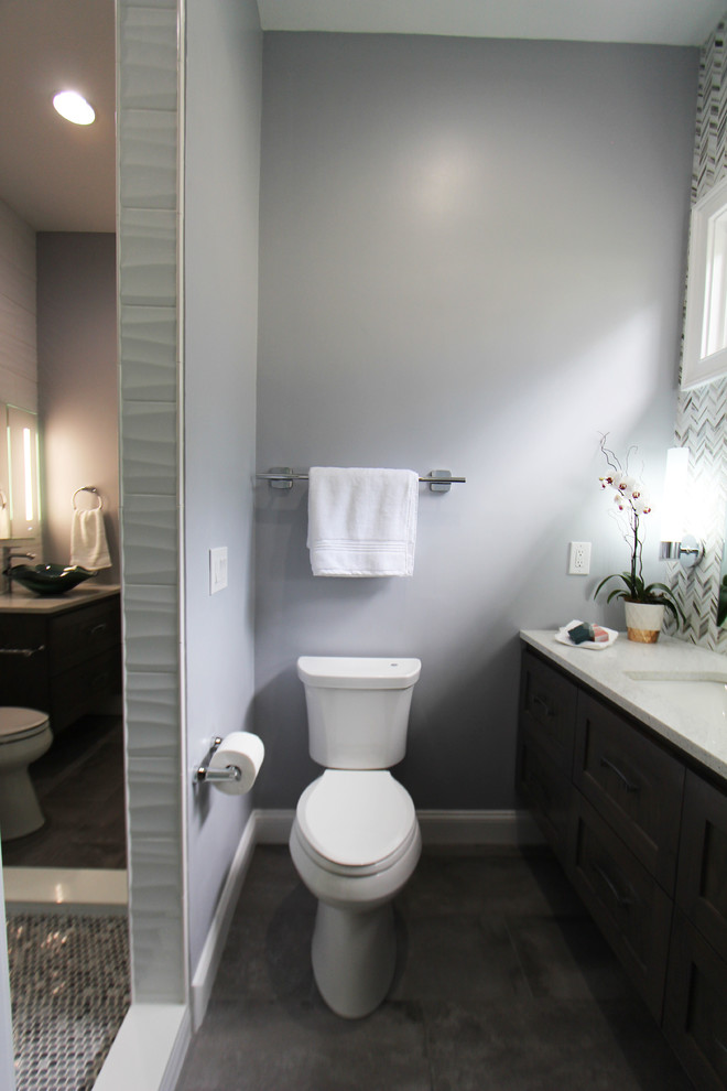 Design ideas for a mid-sized contemporary kids bathroom in Atlanta with beaded inset cabinets, dark wood cabinets, a double shower, a two-piece toilet, white tile, ceramic tile, grey walls, porcelain floors, a vessel sink, engineered quartz benchtops, grey floor, a hinged shower door and white benchtops.