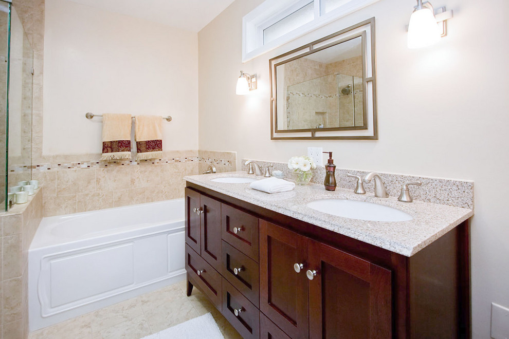 Bathroom - mid-sized traditional master bathroom idea in Los Angeles with recessed-panel cabinets, dark wood cabinets, a one-piece toilet, beige walls, a console sink and concrete countertops