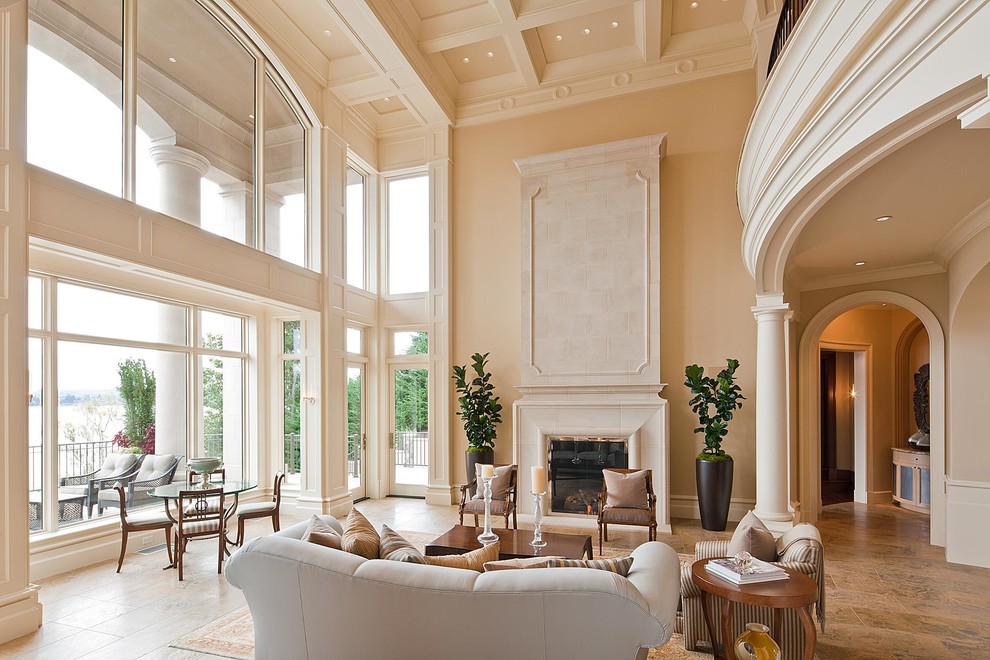 Mediterranean living room in Seattle with beige walls and a standard fireplace.
