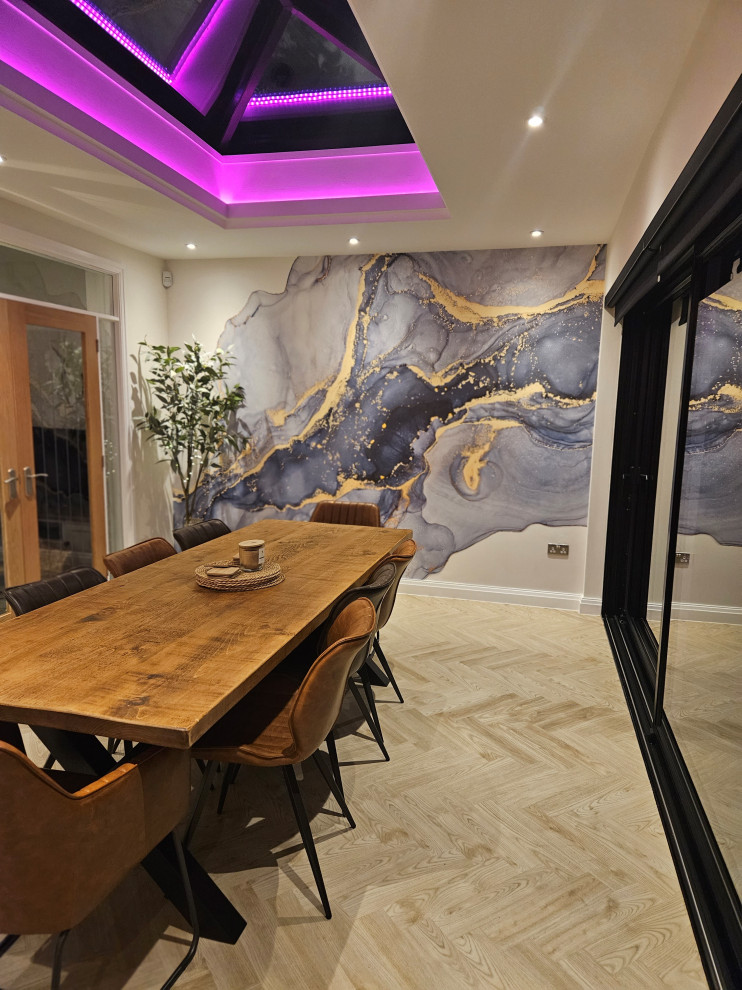 Photo of a medium sized modern kitchen/dining room in Other with blue walls, wallpapered walls and a feature wall.
