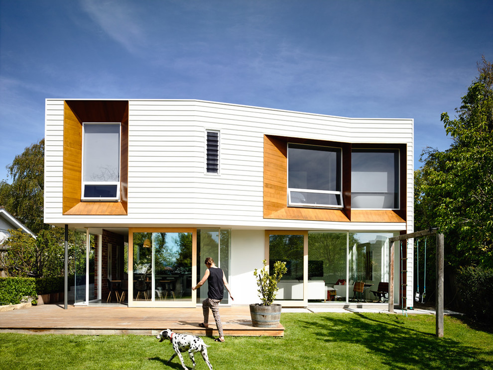 Inspiration for a contemporary one-storey white exterior in Hobart with wood siding.