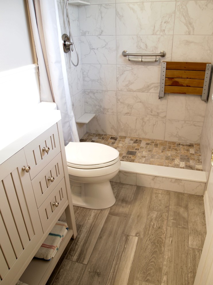This is an example of a small modern master bathroom in Tampa with open cabinets, beige cabinets, an alcove tub, an alcove shower, a two-piece toilet, beige tile, ceramic tile, beige walls, ceramic floors, an undermount sink and granite benchtops.