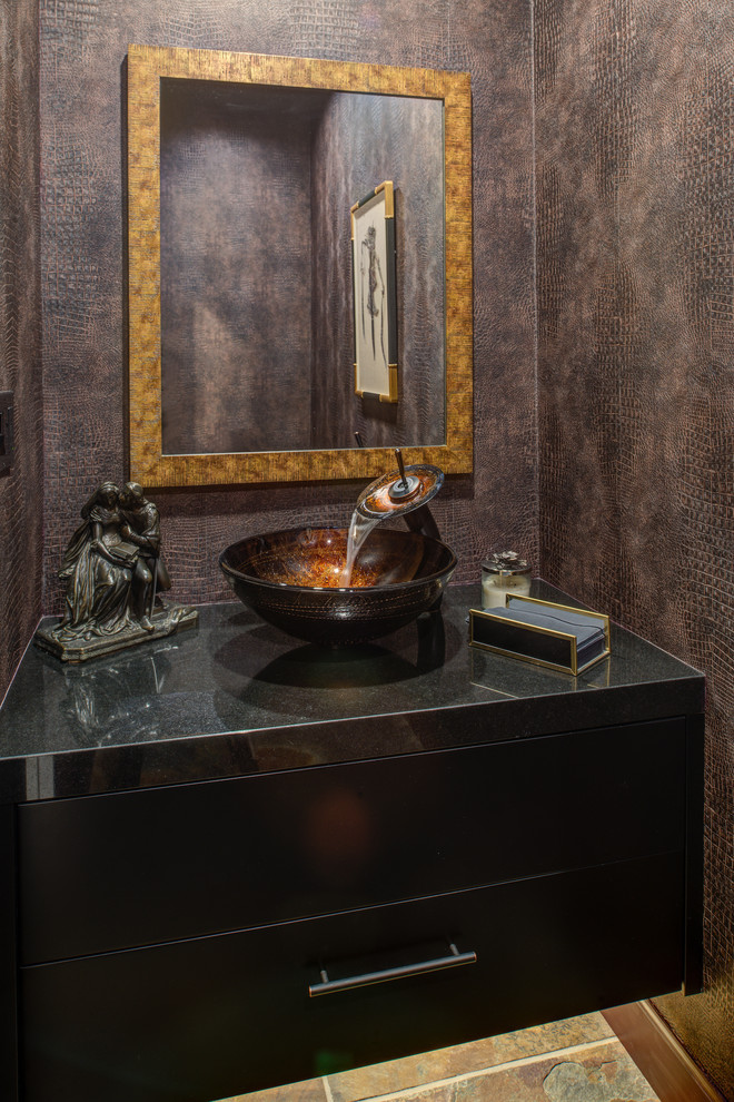 This is an example of a small contemporary powder room in San Francisco with flat-panel cabinets, black cabinets, brown walls, a vessel sink, engineered quartz benchtops and multi-coloured floor.