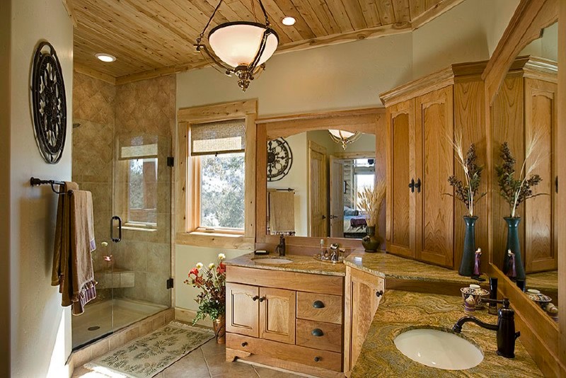 Example of a large transitional beige tile and ceramic tile ceramic tile alcove shower design in Albuquerque with furniture-like cabinets, medium tone wood cabinets, granite countertops and beige walls