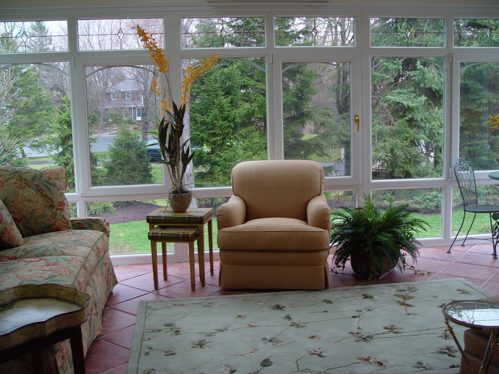This is an example of a mid-sized traditional sunroom in New York with ceramic floors, no fireplace and a standard ceiling.