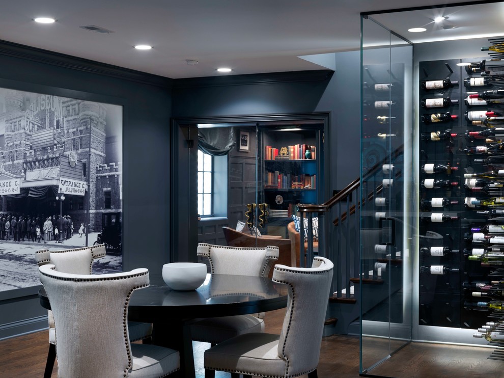 Design ideas for a mid-sized transitional wine cellar in Chicago with dark hardwood floors, display racks and brown floor.