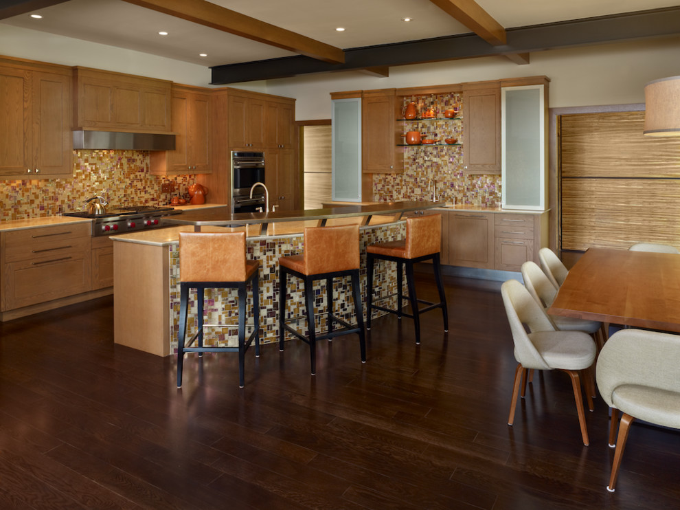 Photo of a large contemporary l-shaped eat-in kitchen in Denver with mosaic tile splashback, an undermount sink, shaker cabinets, light wood cabinets, granite benchtops, multi-coloured splashback, stainless steel appliances, dark hardwood floors and with island.