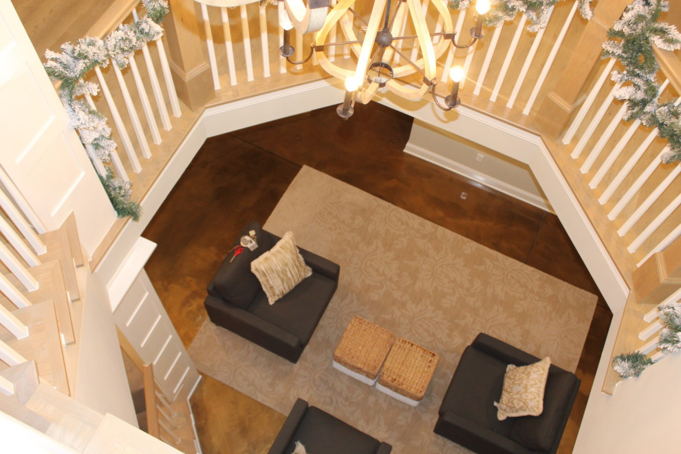 This is an example of a large country wood curved staircase in Columbus with carpet risers and wood railing.