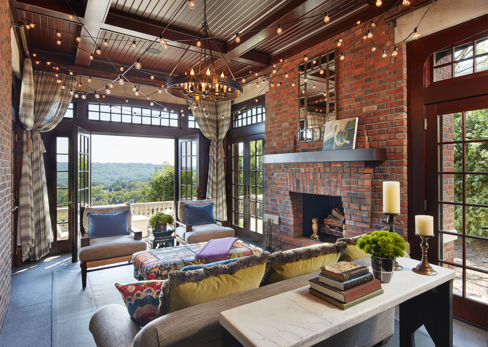 Traditional sunroom in Minneapolis with a standard fireplace, a brick fireplace surround and a standard ceiling.
