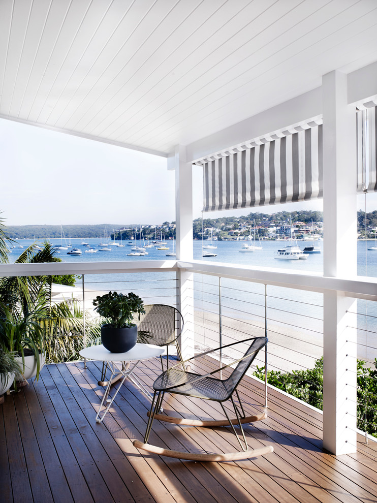 Contemporary deck in Sydney with a roof extension.
