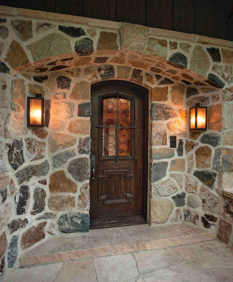 Example of a mountain style home design design in Denver