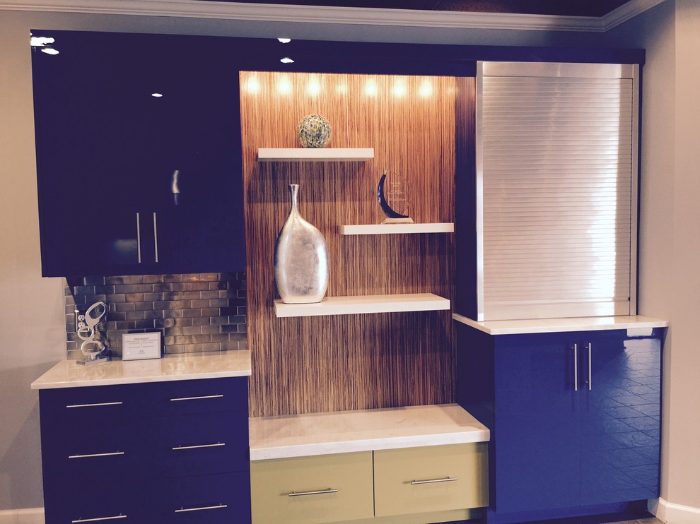 Contemporary galley separate kitchen in DC Metro with stainless steel cabinets, marble benchtops and mirror splashback.