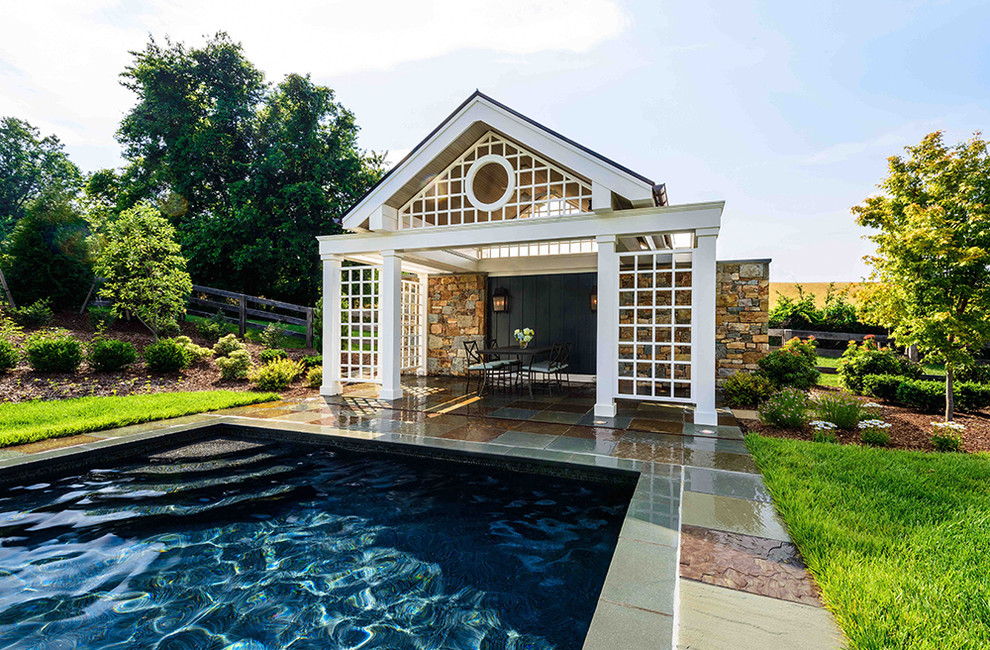 Design ideas for a large traditional backyard rectangular natural pool in Baltimore with a pool house.