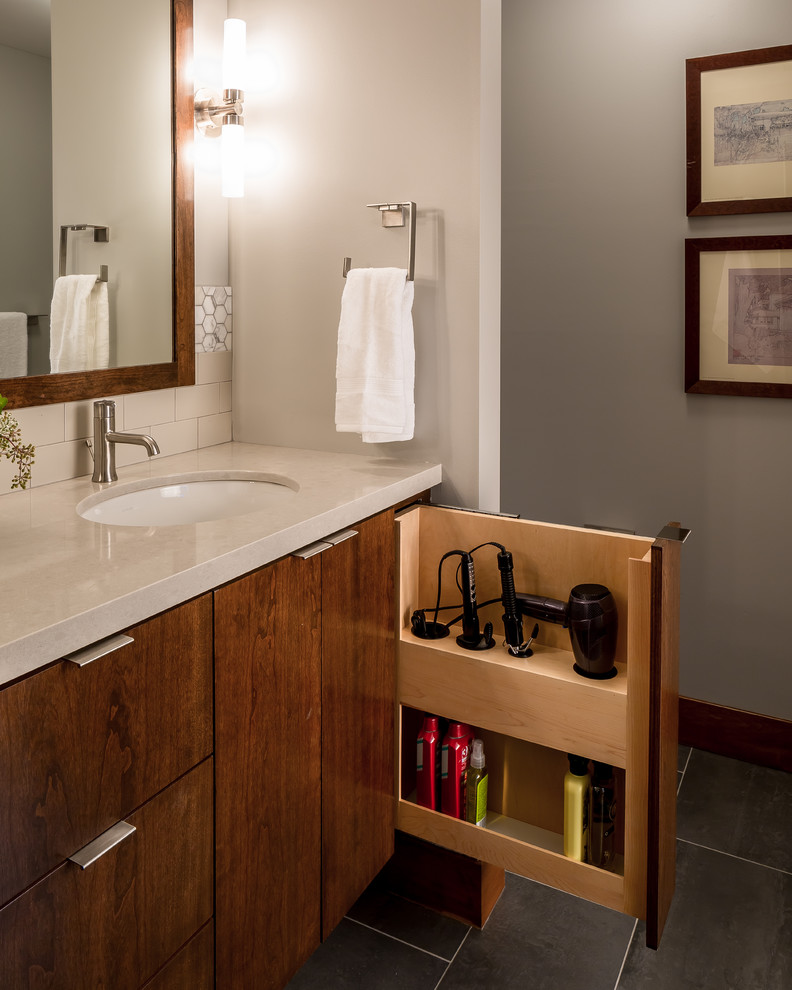 Photo of a mid-sized contemporary master bathroom in Minneapolis with flat-panel cabinets, medium wood cabinets, engineered quartz benchtops, porcelain tile, porcelain floors, an undermount sink, beige tile and grey walls.