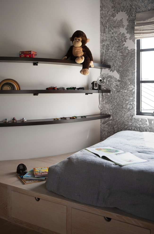 Hill Country Modern Meets Southlake, Texas - This Hill Country Modern home in Southlake combines modern design with comfort, featuring light-filled spaces and unique details reflecting the family's eclectic style for play and sophistication. 

This playful kid's room features a blue ceiling that adds a touch of whimsy. It is complemented by an elegant gray-patterned accent wall and charming decor, creating a stylish and inviting space.