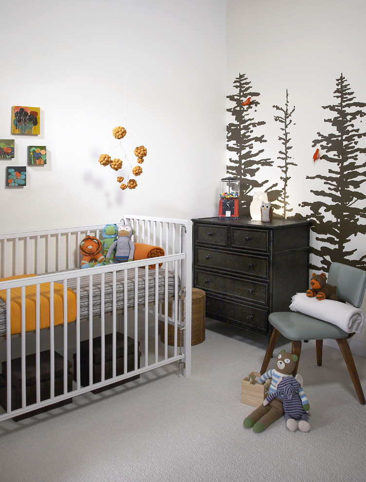 This is an example of a modern gender-neutral nursery in Chicago with white walls and carpet.
