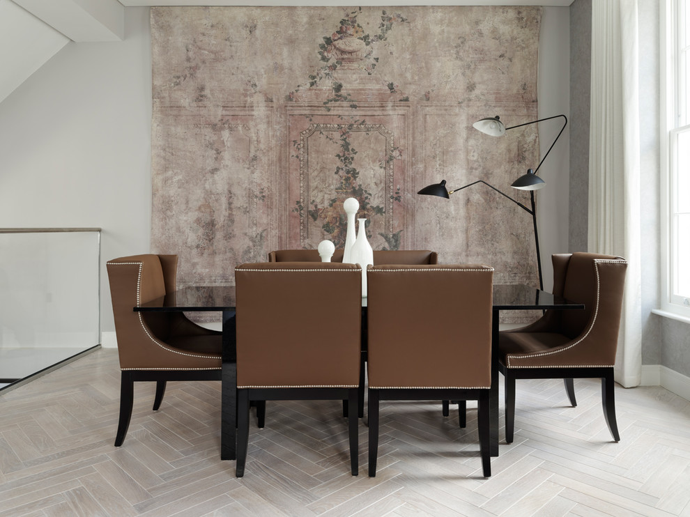 This is an example of a mid-sized contemporary dining room in London with grey floor.