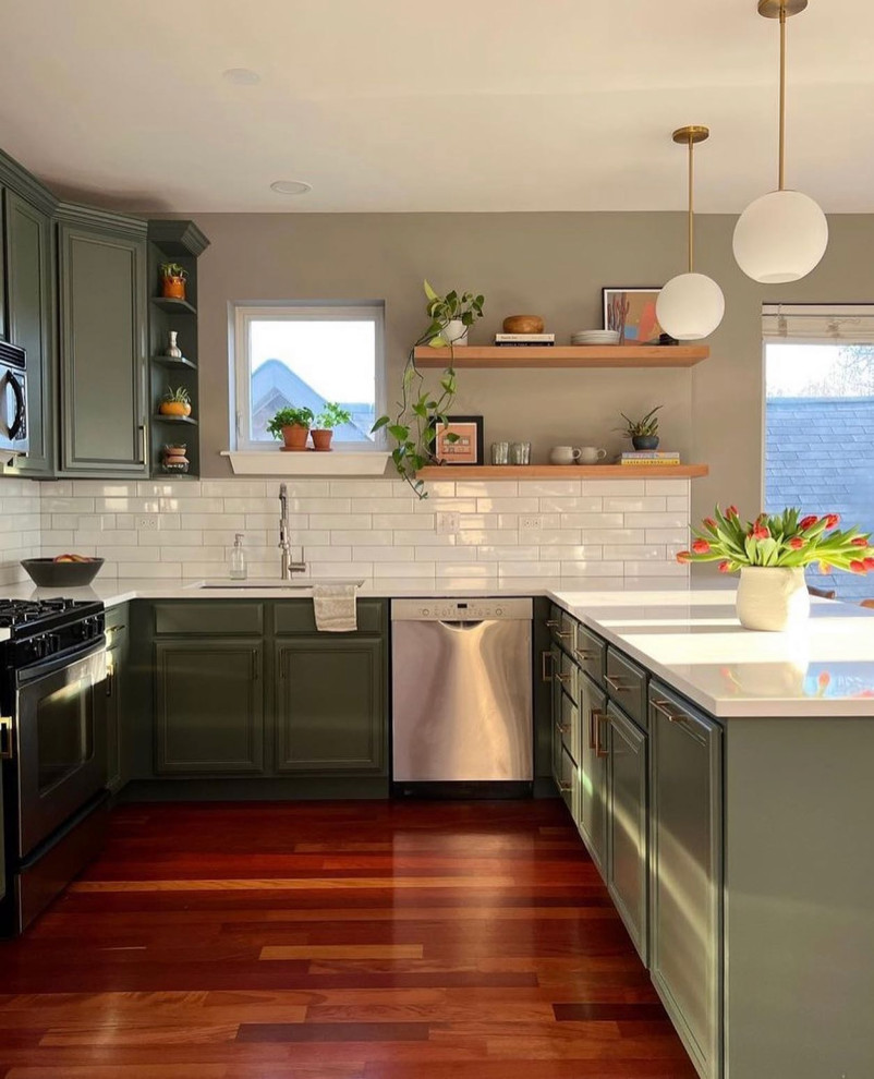 Example of a mid-sized u-shaped eat-in kitchen design in Chicago with green cabinets, white backsplash, subway tile backsplash, no island and white countertops