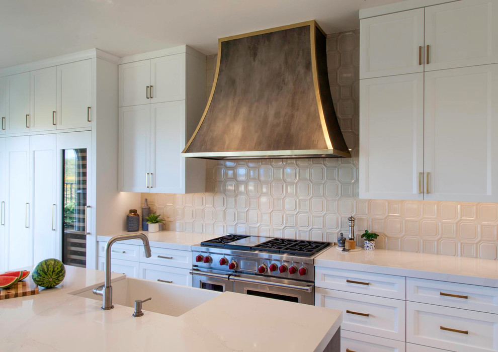 Example of a large transitional l-shaped open concept kitchen design in Denver with shaker cabinets, white cabinets and an island
