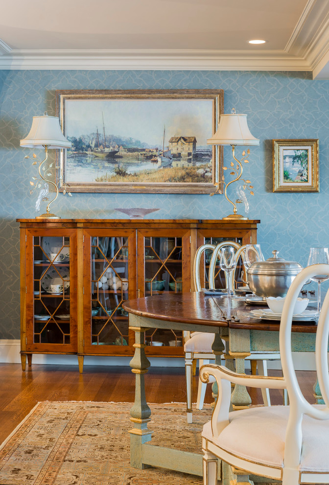 Photo of a mid-sized traditional dining room in Boston with blue walls and medium hardwood floors.