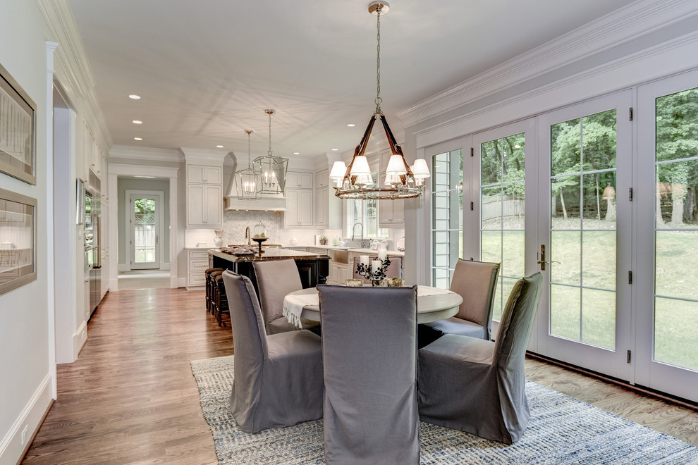 Inspiration for a large transitional kitchen/dining combo in DC Metro with dark hardwood floors.