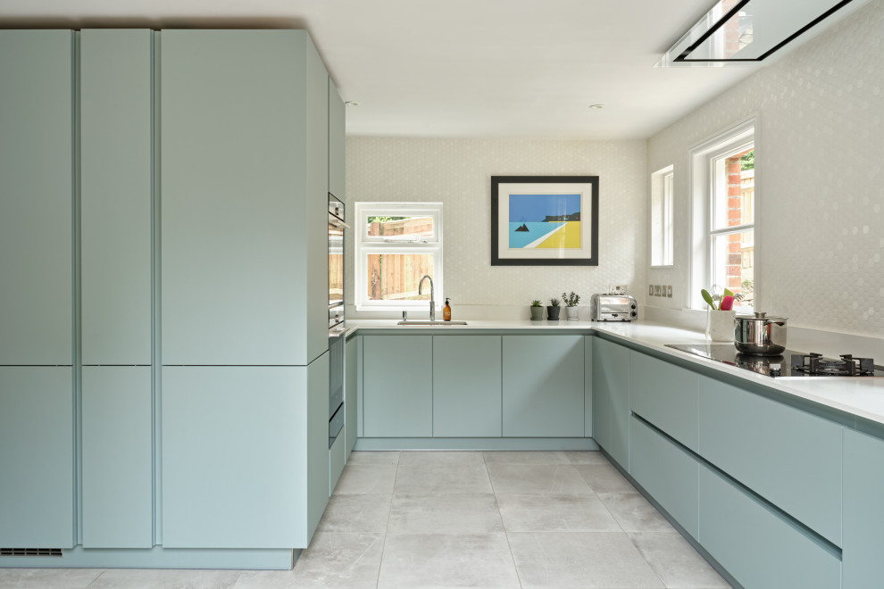 This is an example of a contemporary grey and teal kitchen in Other.