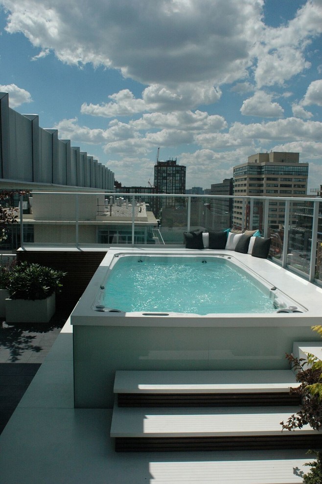 Design ideas for a mid-sized modern rooftop rectangular pool in Phoenix with a hot tub.