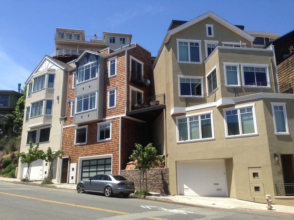 This is an example of an expansive contemporary three-storey beige exterior in San Francisco with mixed siding.