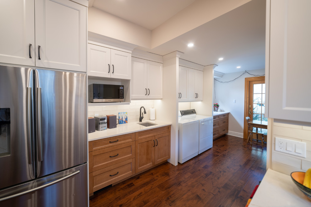 Example of a transitional kitchen design in Toronto