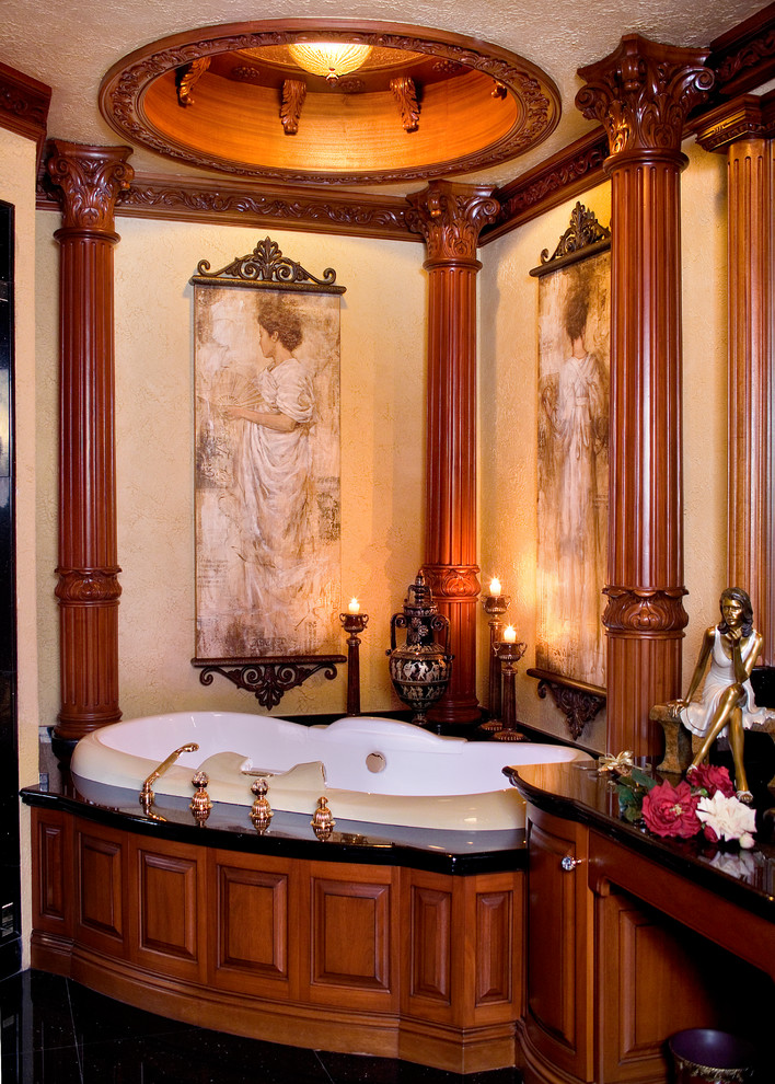 Traditional master bathroom in New York with a drop-in tub and beige walls.